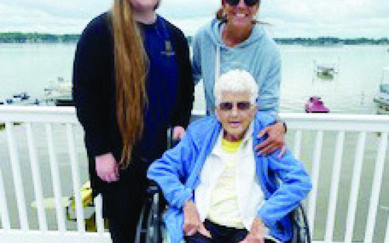 Jayme Fronk and Heidi Hoffman with Eleanor Cochenour at her lake home