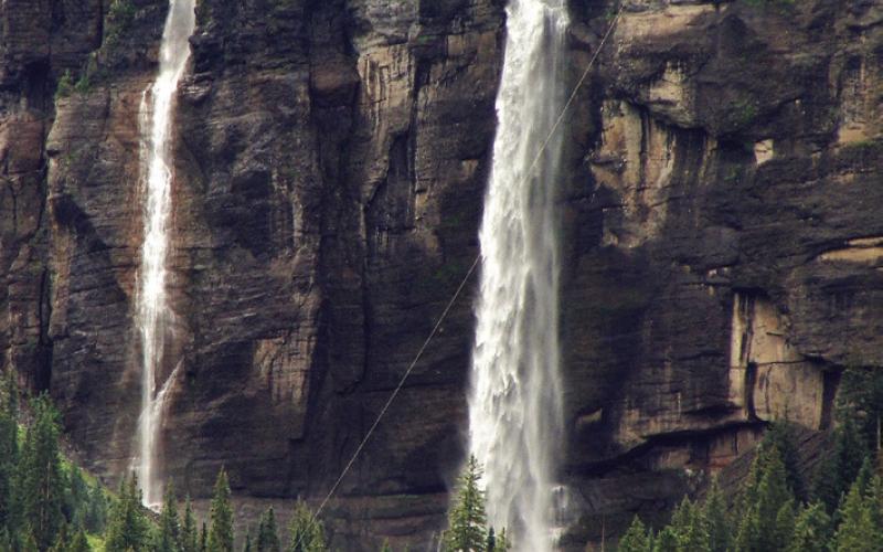 Telluride sits in a box canyon where twin waterfalls spill over the cliff.
