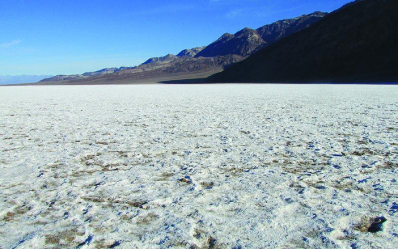 The salt flats at Badwater crunch under foot like ice crystals. Foolish visitors sometimes start to walk gingerly as if it really were ice.