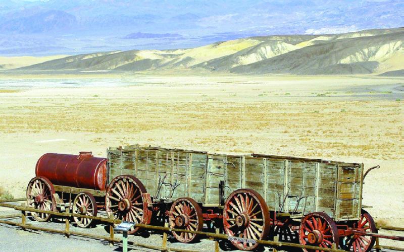 Borax was transported in the famous 20-mule-team wagons. The water tank was extra weight but necessary for the survival of mules and men on the month-long round trip.