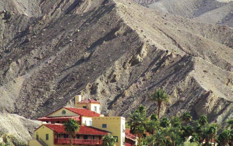 The Furnace Creek Inn is in an elevated position for better views of the valley. Also to be at a reliable water source as you can see from the greenery.