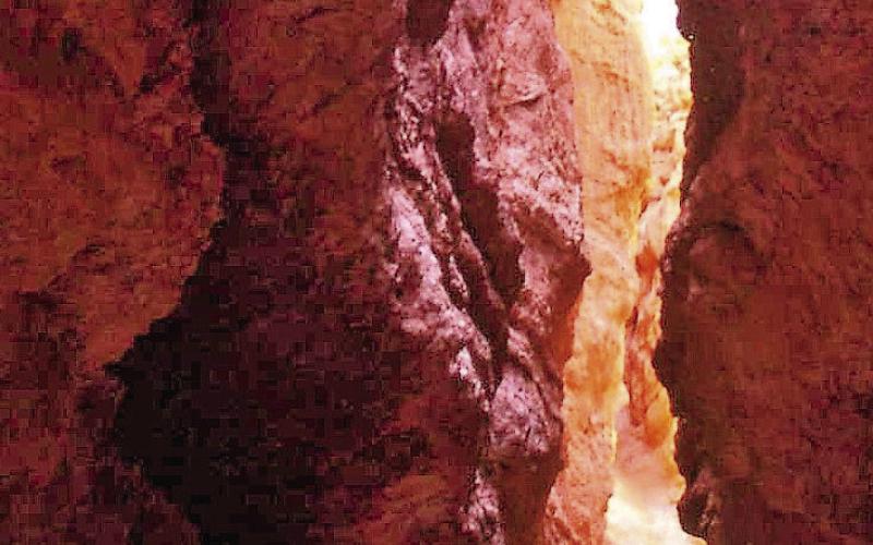 Wall Street is a narrow passageway between vertical cliffs. There is also a small rock opening called the Fat Lady Squeeze that will not be shown because its very name is offensive to some.