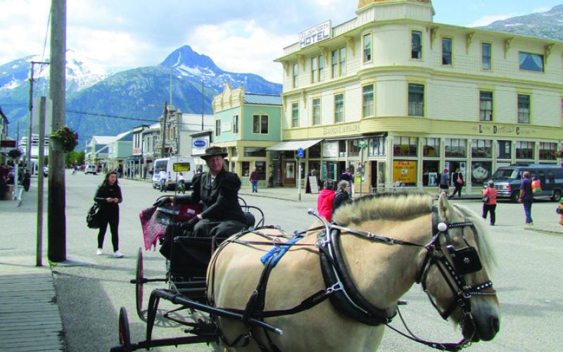 Skagway welcomes passengers from cruise ships that dock at the foot of the main street. The city works hard to maintain the look of Gold Rush days.