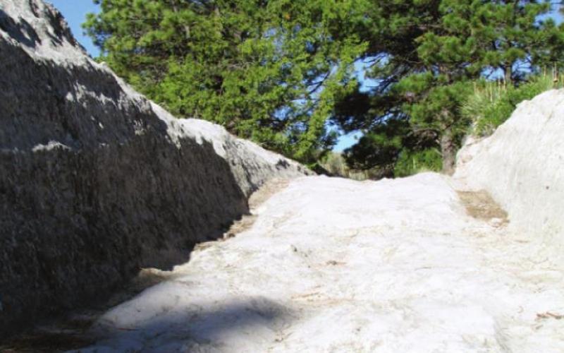 Thousands of pioneer wagon wheels carved four-foot-deep ruts in solid rock. Almost as bad as an average street in Toledo.