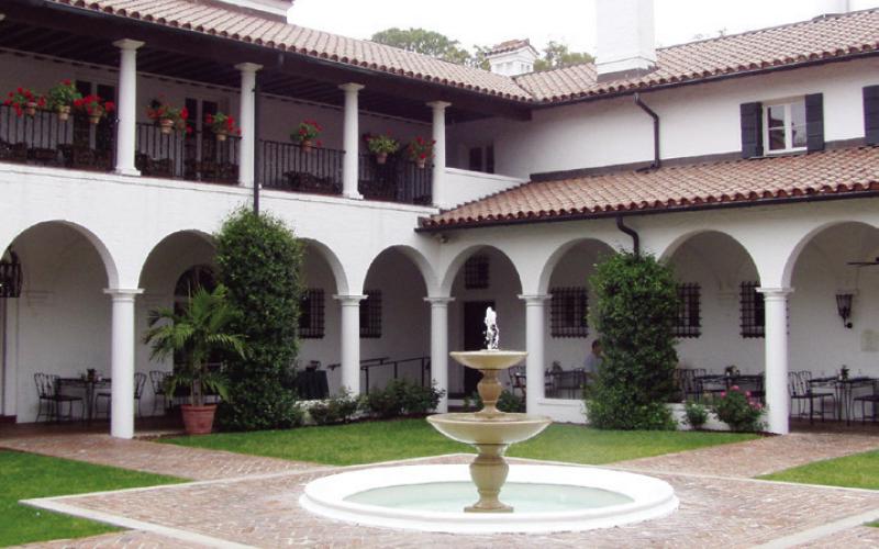 The central courtyard with fountain at Crane Cottage represents the evolution from hunting camp rusticity to residence for the rich and famous.