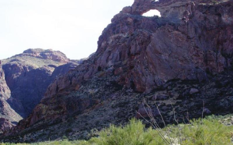 There is a natural arch in Alamo Canyon. If you squint really tight, you may see two. (But not in this view.)