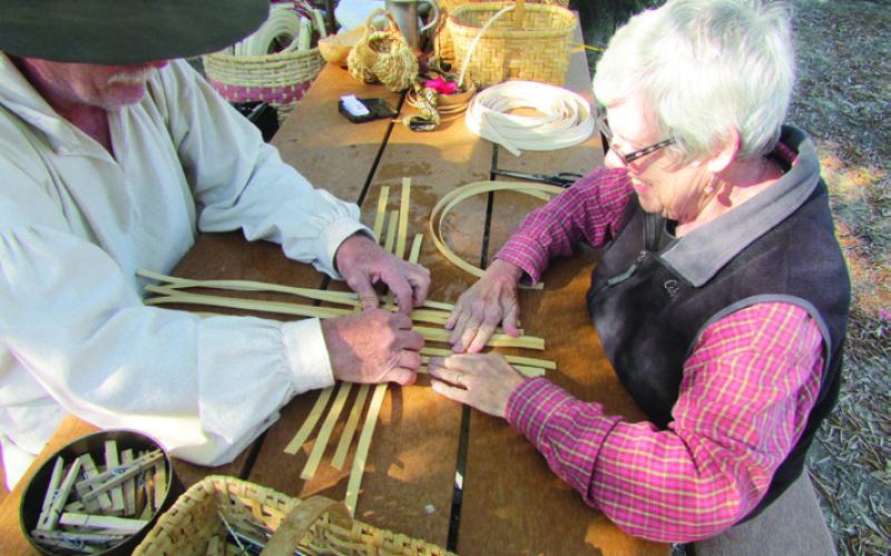 During Pioneer Days on the Trace, J.D. taught Shirley how to weave a basket.