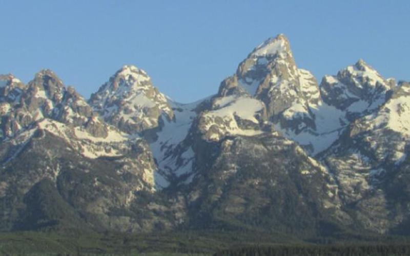 The Tetons, unobstructed by foothills, rise dramatically to form the western edge of Jackson Hole.