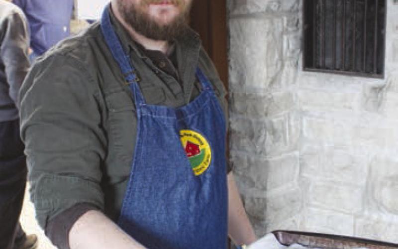 local member cooks food for community