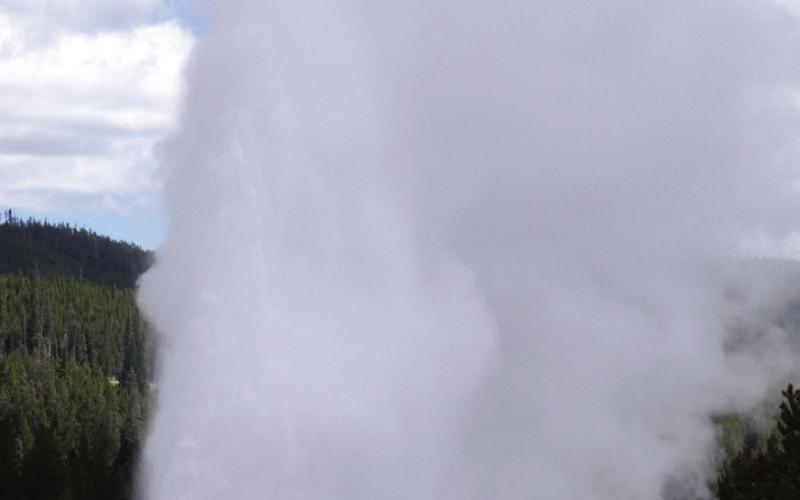 You could shoulder your way into the crowd at Old Faithful or view eruptions from the upper deck of the Inn.