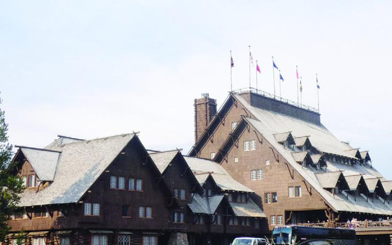 Old Faithful Inn is a historic landmark that barely escaped the Great Fire and has recently been reinforced against the frequent tremors associated with geothermal activity.