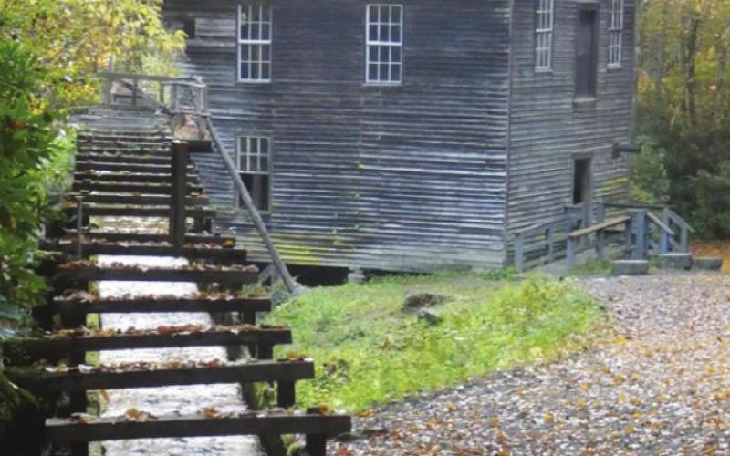 Power for the mill wheel is provided by water diverted via the mill race from a nearby stream and then returned to the stream.