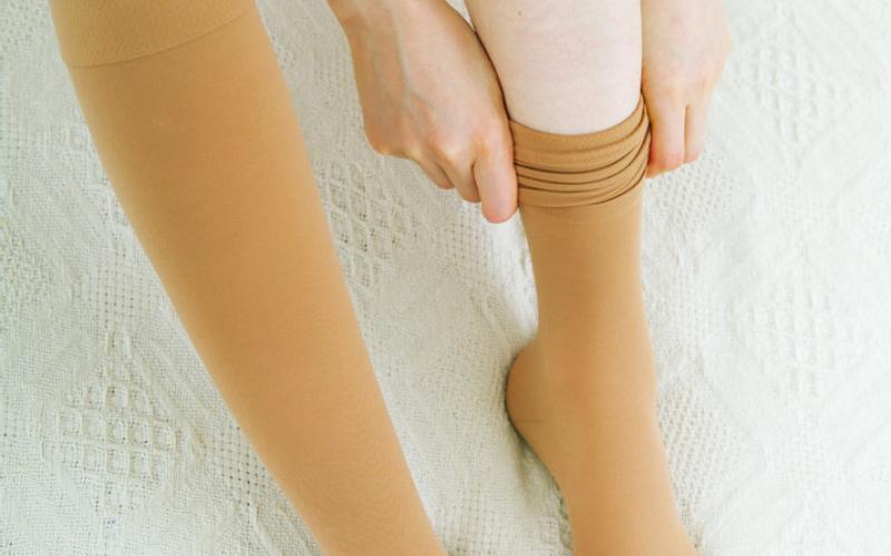 Designed for compression therapy, compression stockings are specially made, snug-fitting, stretchy socks constructed using elastic fibers or rubber. These fibers apply gentle pressure to your legs and ankles, promoting blood flow from your legs to your heart. Compression socks can also reduce pain and swelling in your ankles and legs.