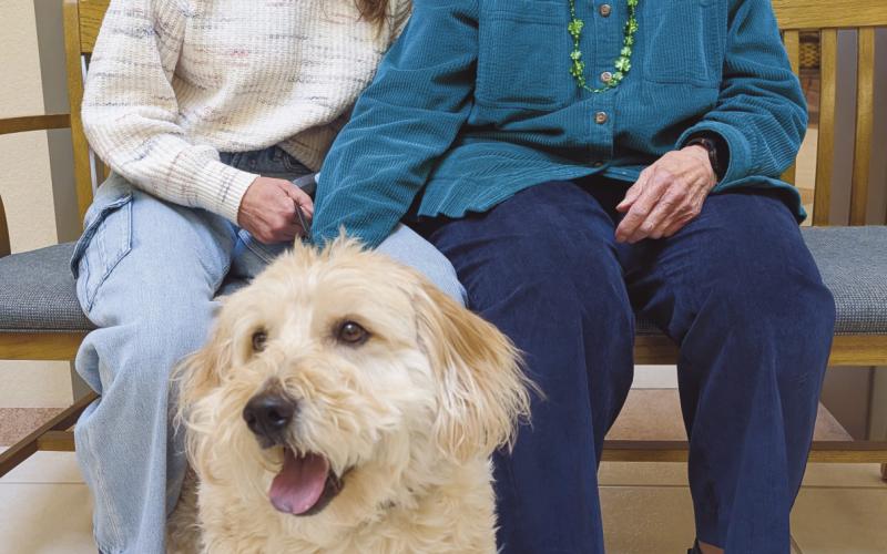 Phyllis Tucker and Heidi Hoffman with their buddy, Tucker.
