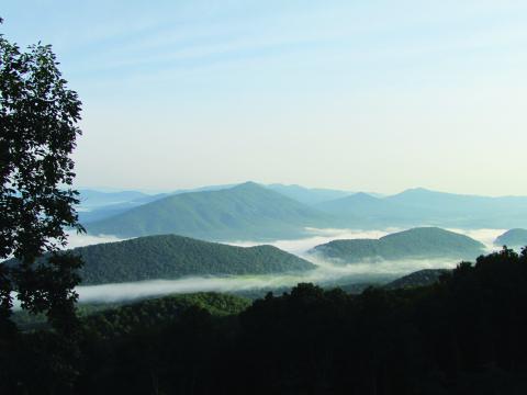 Morning fog hanging between the mountains is much more beautiful when viewed from above.