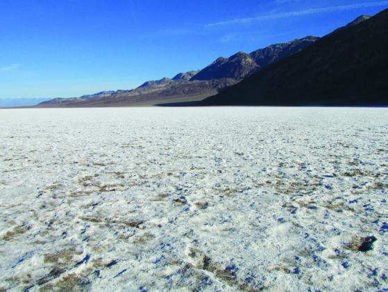 The salt flats at Badwater crunch under foot like ice crystals. Foolish visitors sometimes start to walk gingerly as if it really were ice.