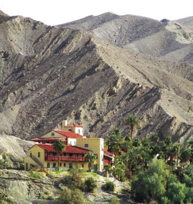 The Furnace Creek Inn is in an elevated position for better views of the valley. Also to be at a reliable water source as you can see from the greenery.
