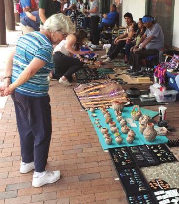 Trade with Indians continues today in the arcade of the Governor’s Palace in Santa Fe. Four-inch clay pots at $350 seemed a little steep, but they are willing to haggle.