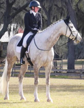 Participants in equestrian events can look elegant even when just hanging around doing nothing.