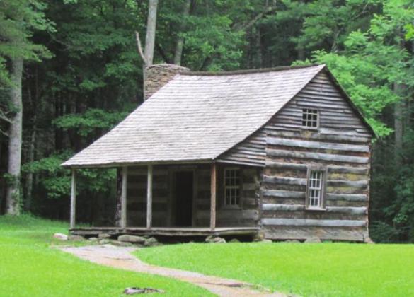 Like most Cove pioneers, Carter Shield placed his cabin back in the woods in order to preserve valuable crop land out on the floor of what is now meadow.