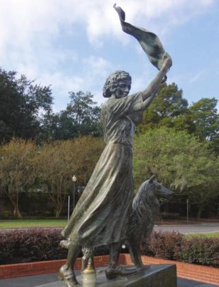 Florence Martus, Savannah’s “Waving Girl,” is memorialized at the end of River St. It is said that she greeted every ship entering Savannah Harbor, towel by day and lantern by night, for 44 years beginning in 1887.