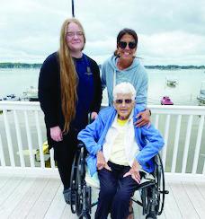 Jayme Fronk and Heidi Hoffman with Eleanor Cochenour at her lake home